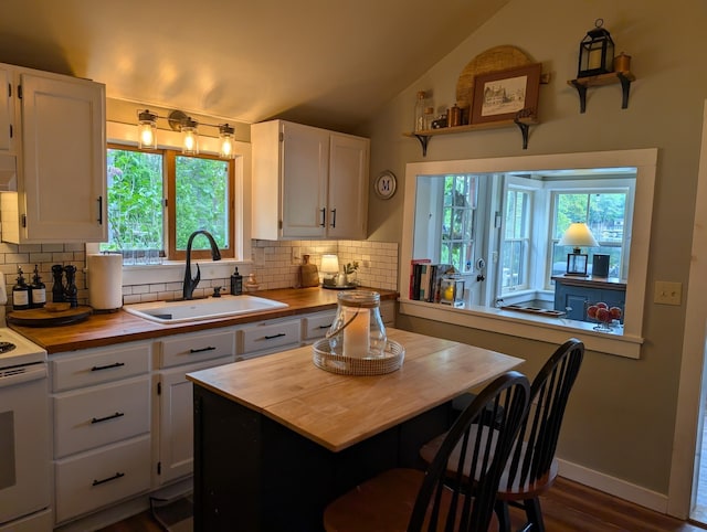 175 Rolfe Pond Dr, Hopkinton, NH 03229 - kitchen with wooden counters, a sink, white range with electric stovetop, tasteful backsplash, and vaulted ceiling