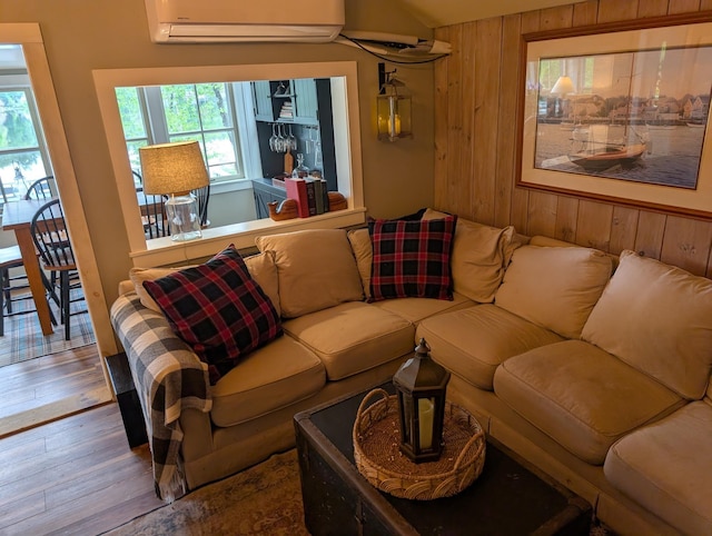 175 Rolfe Pond Dr, Hopkinton, NH 03229 - living area featuring wood walls, an AC wall unit, and wood finished floors
