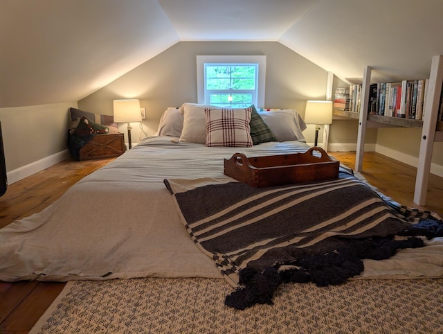 175 Rolfe Pond Dr, Hopkinton, NH 03229 - bedroom with vaulted ceiling, baseboards, and wood finished floors