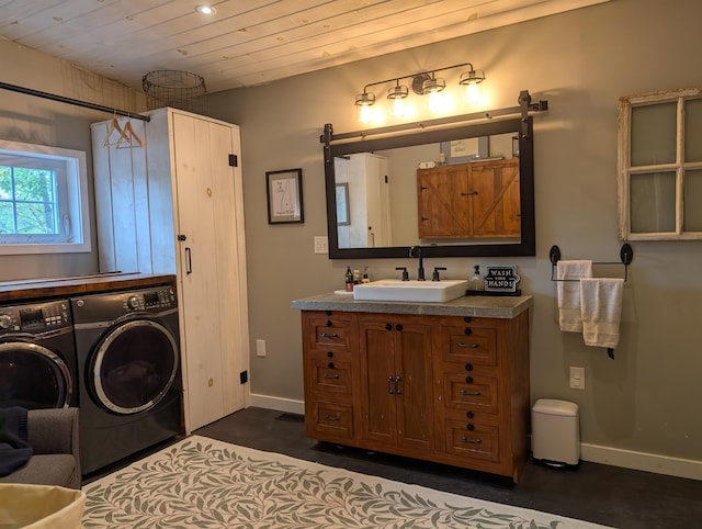175 Rolfe Pond Dr, Hopkinton, NH 03229 - bathroom with washing machine and clothes dryer, vanity, baseboards, and wooden ceiling