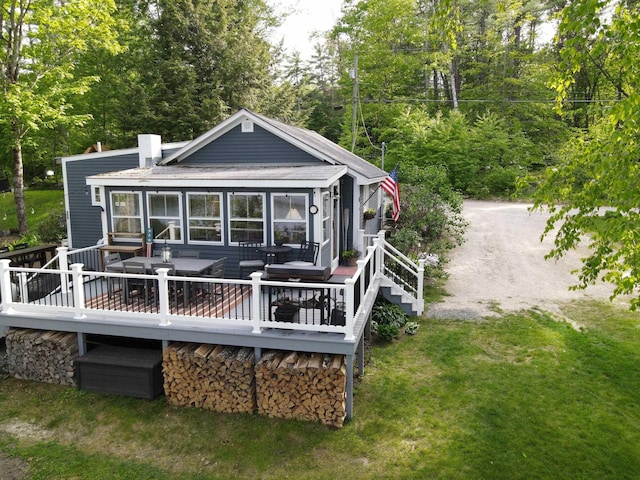 175 Rolfe Pond Dr, Hopkinton, NH 03229 - rear view of property featuring a wooden deck, a chimney, a yard, and outdoor dining space
