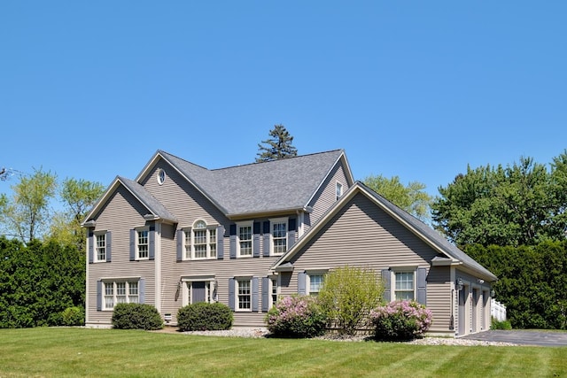 3 Playhouse Cir, Hampton, NH 03842 - colonial house with a front yard, roof with shingles, and driveway