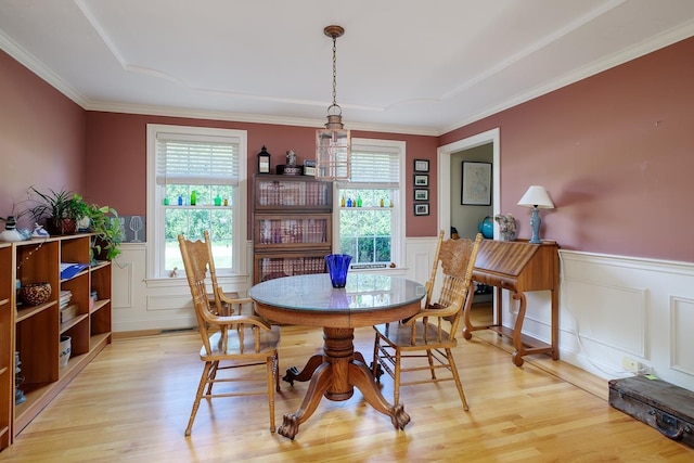 3 Playhouse Cir, Hampton, NH 03842 - dining area featuring wainscoting, healthy amount of natural light, light wood-style flooring, a decorative wall, and crown molding