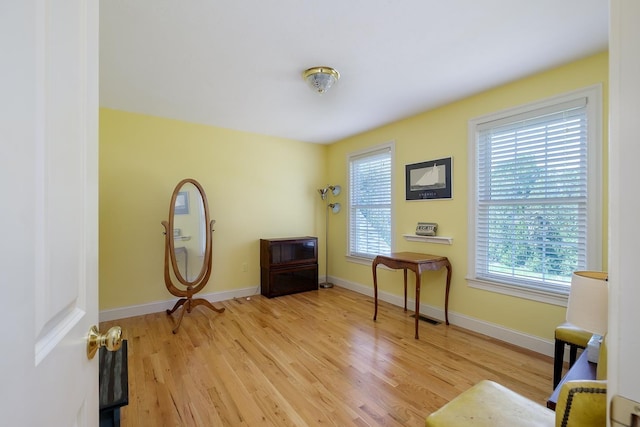 3 Playhouse Cir, Hampton, NH 03842 - sitting room with light wood finished floors and baseboards