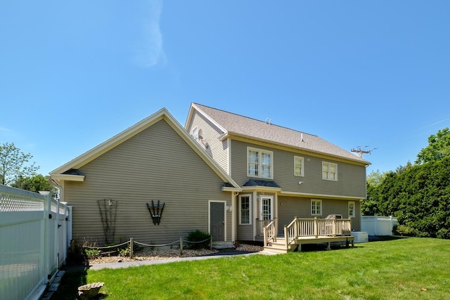 3 Playhouse Cir, Hampton, NH 03842 - back of property with a wooden deck and central AC