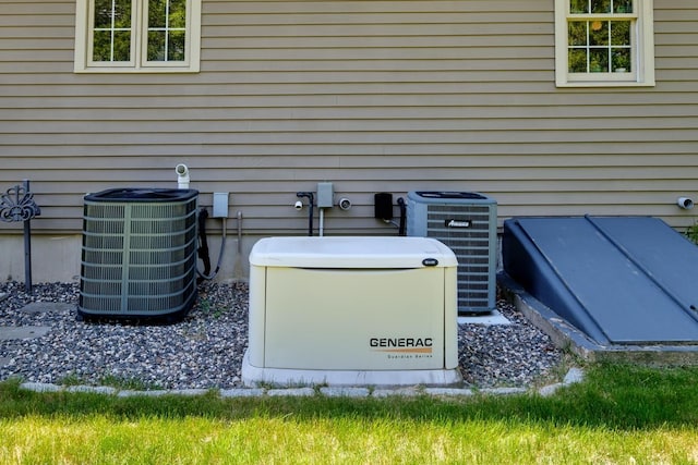 3 Playhouse Cir, Hampton, NH 03842 - exterior view of a power unit, central AC unit, and a bulkhead entry