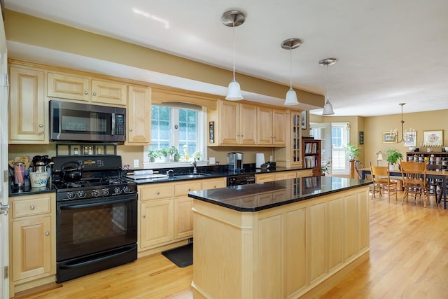 3 Playhouse Cir, Hampton, NH 03842 - kitchen featuring black appliances, light brown cabinetry, dark countertops, light wood-style flooring, and plenty of natural light