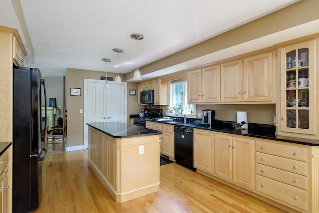3 Playhouse Cir, Hampton, NH 03842 - kitchen featuring black appliances, light brown cabinetry, light wood-style floors, and dark countertops