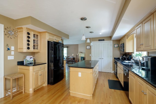 3 Playhouse Cir, Hampton, NH 03842 - kitchen with black appliances, a center island, light brown cabinetry, and dark countertops
