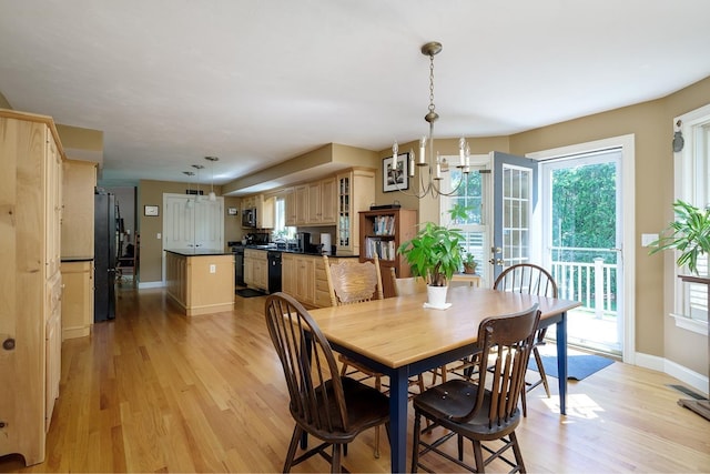 3 Playhouse Cir, Hampton, NH 03842 - dining room featuring light wood-type flooring, baseboards, and a chandelier