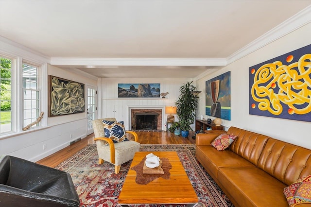 236 Main St, Jaffrey, NH 03452 - living area with wood finished floors, ornamental molding, and a brick fireplace
