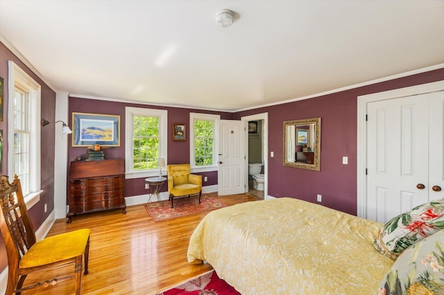 236 Main St, Jaffrey, NH 03452 - bedroom with light wood-style floors, a closet, baseboards, and ornamental molding
