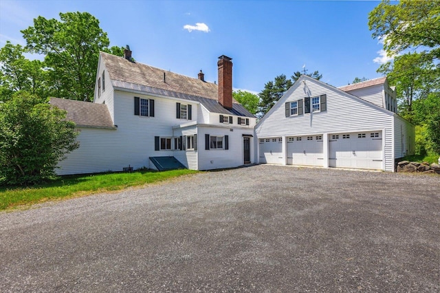 236 Main St, Jaffrey, NH 03452 - back of property with a chimney and a garage