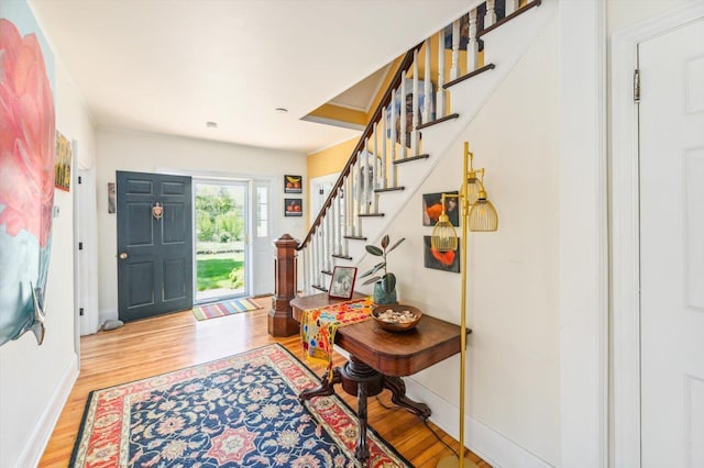 236 Main St, Jaffrey, NH 03452 - foyer featuring wood finished floors, stairway, and baseboards