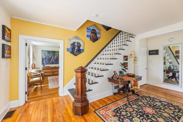 236 Main St, Jaffrey, NH 03452 - stairs featuring wood finished floors, baseboards, and crown molding