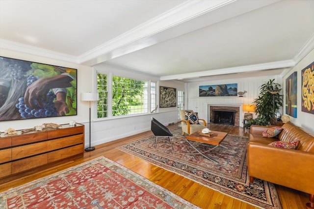 236 Main St, Jaffrey, NH 03452 - living area with wood finished floors, ornamental molding, a brick fireplace, and baseboards