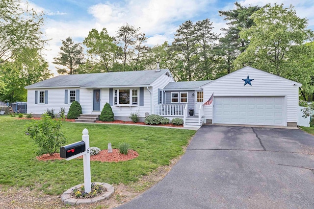 6 Cherry St, Concord, NH 03301 - single story home with an attached garage, asphalt driveway, a front lawn, and a shingled roof