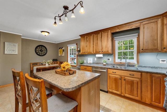 6 Cherry St, Concord, NH 03301 - kitchen featuring dishwasher, a sink, brown cabinets, a breakfast bar, and light tile patterned flooring