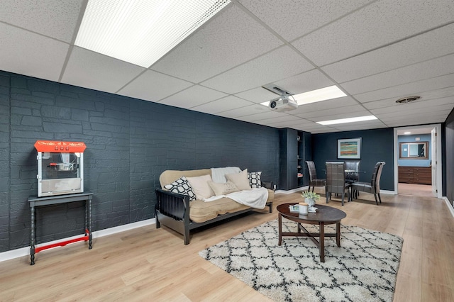 6 Cherry St, Concord, NH 03301 - living room featuring a drop ceiling, wood finished floors, and baseboards