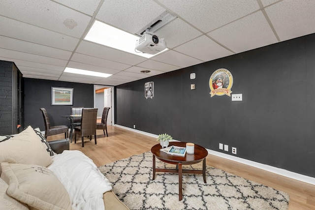 6 Cherry St, Concord, NH 03301 - living room featuring a paneled ceiling, wood finished floors, and baseboards