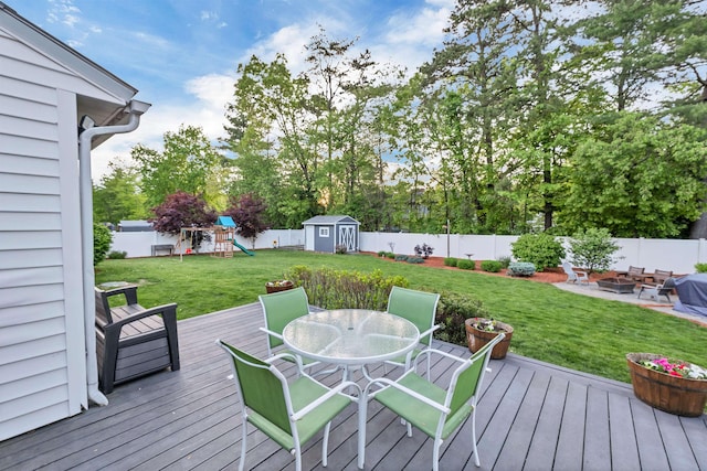 6 Cherry St, Concord, NH 03301 - deck with outdoor dining area, a playground, and view of scattered trees