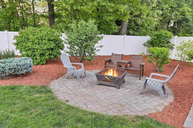 6 Cherry St, Concord, NH 03301 - fenced backyard with a fire pit and a patio