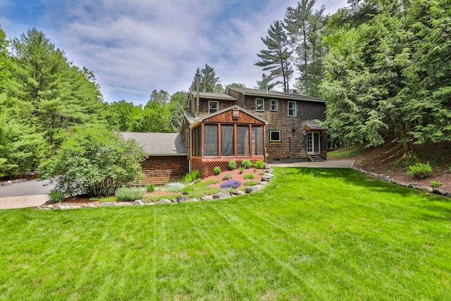 56 Averill Rd, Brookline, NH 03033 - rear view of house featuring a sunroom and a lawn