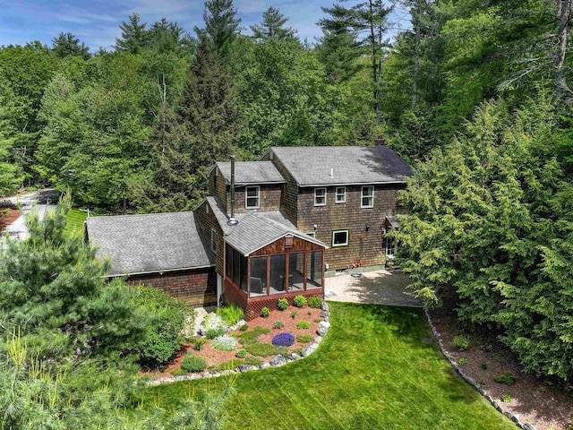 56 Averill Rd, Brookline, NH 03033 - back of property with a sunroom, a shingled roof, a lawn, and a forest view