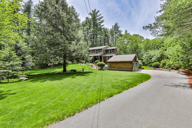 56 Averill Rd, Brookline, NH 03033 - view of front of house featuring a garage, a front lawn, and asphalt driveway