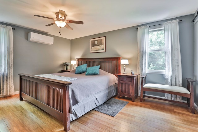 56 Averill Rd, Brookline, NH 03033 - bedroom featuring a wall unit AC, wood finished floors, a ceiling fan, and baseboards