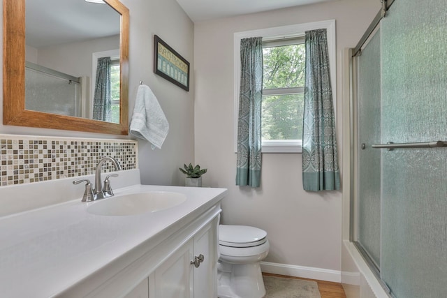 56 Averill Rd, Brookline, NH 03033 - full bathroom featuring toilet, vanity, tasteful backsplash, and baseboards