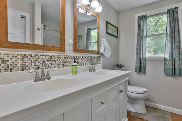 56 Averill Rd, Brookline, NH 03033 - full bathroom with toilet, double vanity, healthy amount of natural light, and baseboards