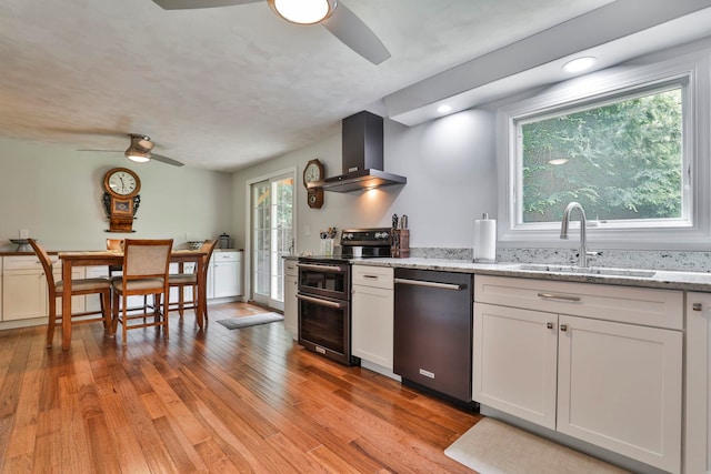 56 Averill Rd, Brookline, NH 03033 - kitchen featuring appliances with stainless steel finishes, ceiling fan, wall chimney range hood, a sink, and recessed lighting