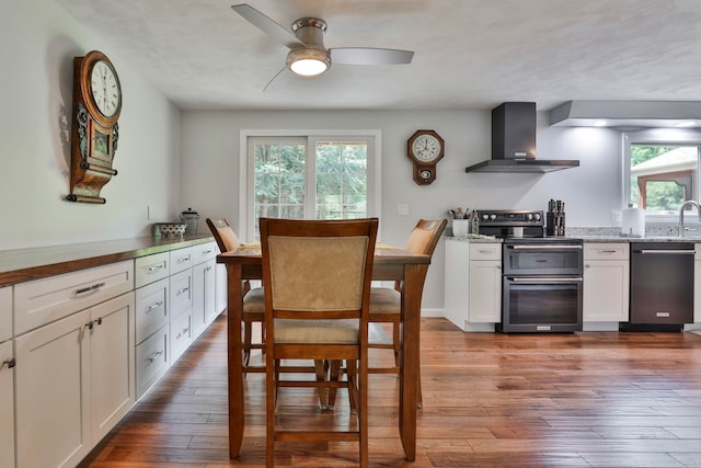 56 Averill Rd, Brookline, NH 03033 - dining space with healthy amount of natural light, ceiling fan, and dark wood-style floors