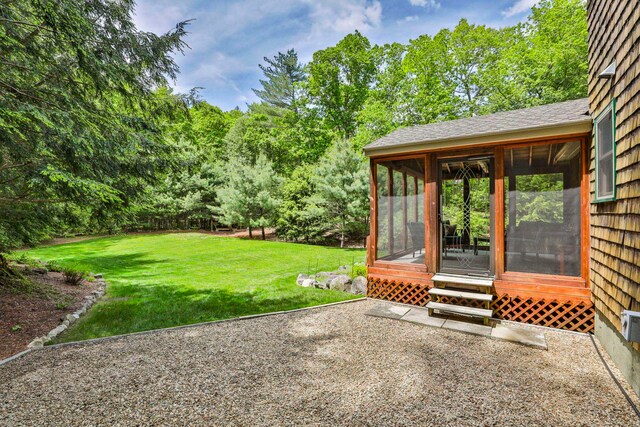 56 Averill Rd, Brookline, NH 03033 - view of green lawn with a sunroom and a patio