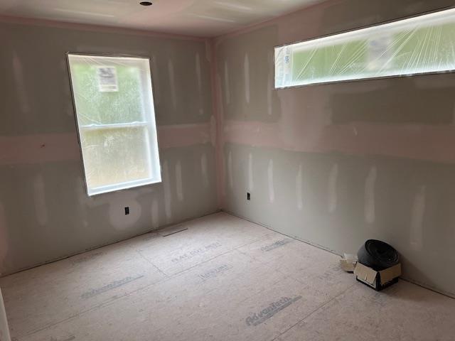 76 River Rd, Pittsfield, NH 03263 - empty room with plenty of natural light