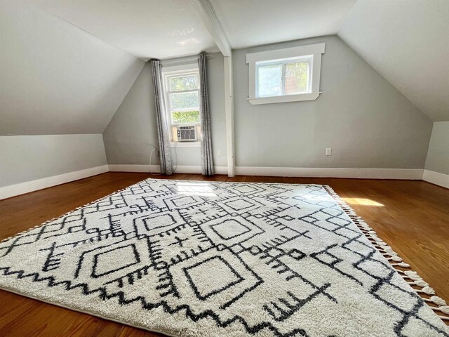 34 S Spring St, Concord, NH 03301 - additional living space with vaulted ceiling, cooling unit, wood finished floors, and baseboards