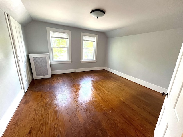 34 S Spring St, Concord, NH 03301 - additional living space featuring lofted ceiling, dark wood-style flooring, and baseboards
