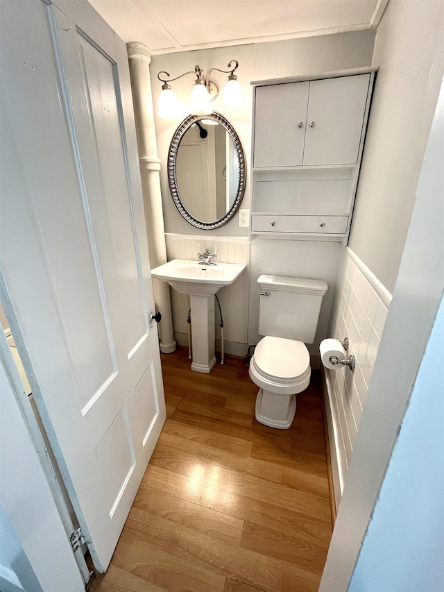 34 S Spring St, Concord, NH 03301 - bathroom featuring wood finished floors, toilet, and a sink