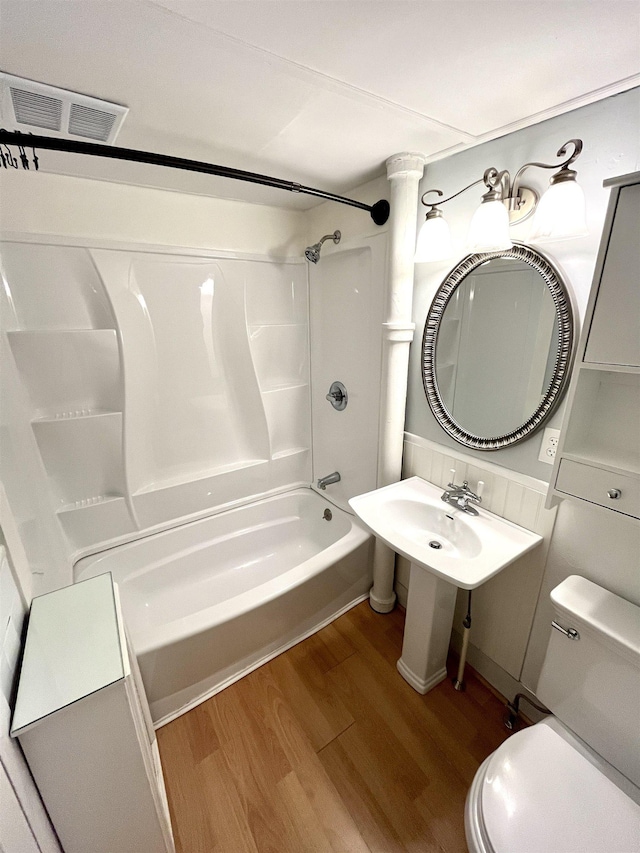34 S Spring St, Concord, NH 03301 - full bath with wood finished floors, toilet, and shower / bath combination