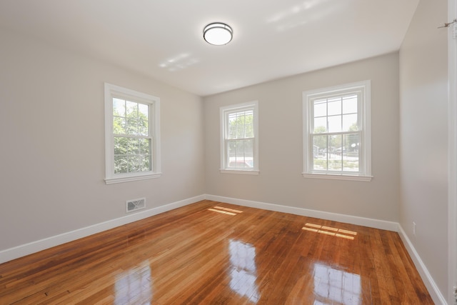 798 Hanover St, Manchester, NH 03104 - unfurnished room with wood-type flooring and baseboards