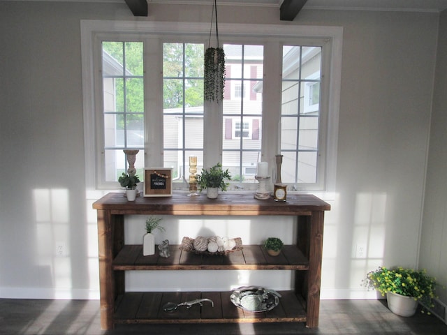 798 Hanover St, Manchester, NH 03104 - detailed view of baseboards, wood finished floors, and crown molding
