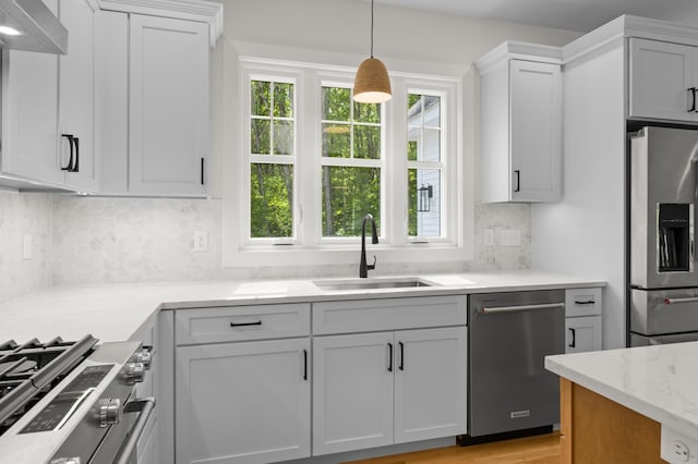 93 Stage Rd, Hampstead, NH 03841 - kitchen with stainless steel appliances, a sink, decorative backsplash, hanging light fixtures, and white cabinets