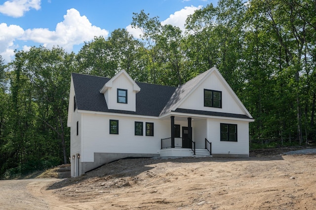93 Stage Rd, Hampstead, NH 03841 - modern farmhouse featuring a porch and a shingled roof