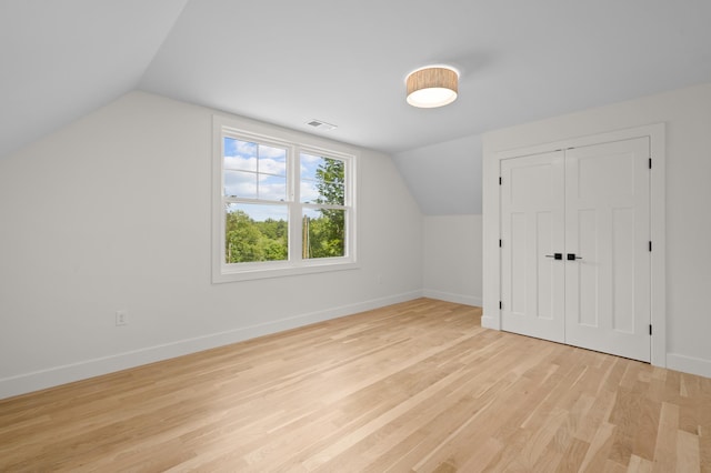 93 Stage Rd, Hampstead, NH 03841 - additional living space with vaulted ceiling, baseboards, and light wood-style flooring