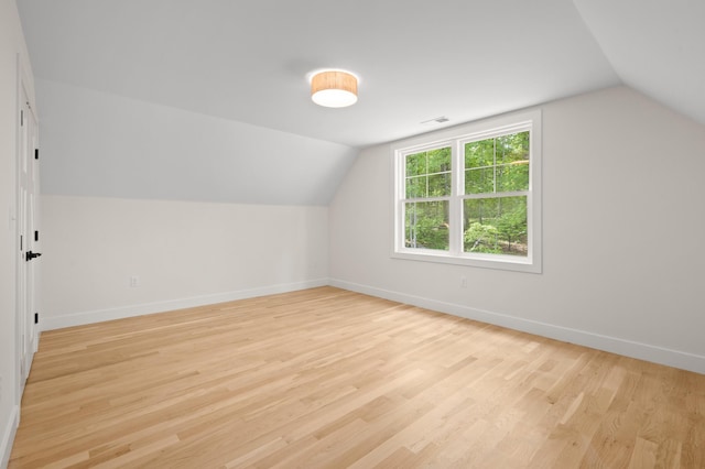 93 Stage Rd, Hampstead, NH 03841 - additional living space with lofted ceiling, baseboards, and light wood-style floors