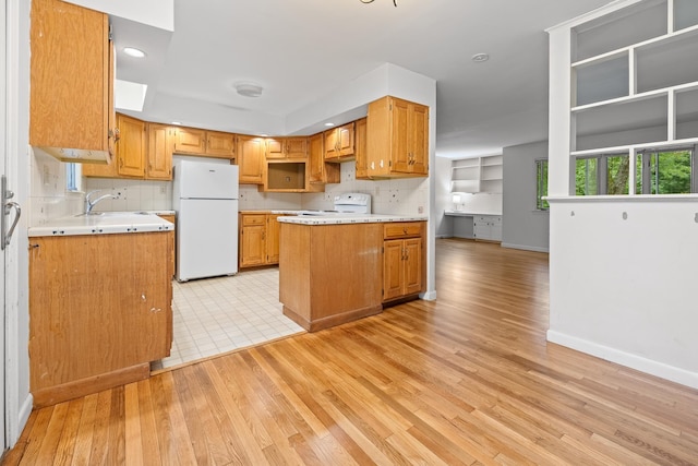 5 Dogford Rd, Hanover, NH 03750 - kitchen with freestanding refrigerator, range, light wood-type flooring, light countertops, and baseboards