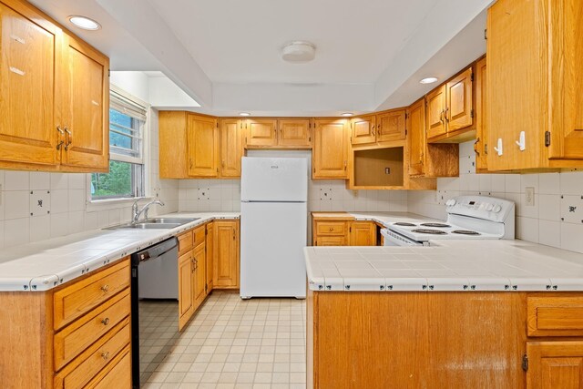 5 Dogford Rd, Hanover, NH 03750 - kitchen featuring white appliances, a sink, a peninsula, tile counters, and decorative backsplash