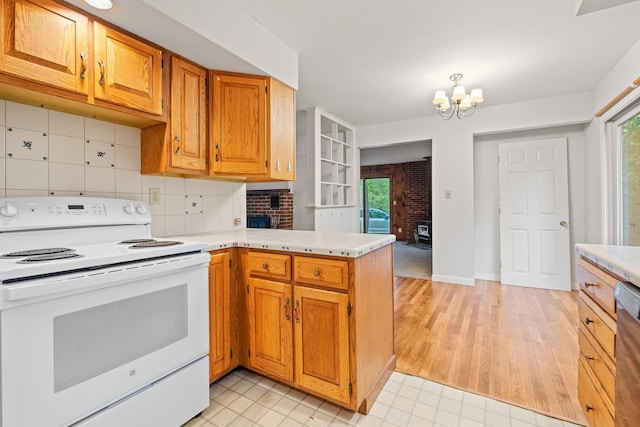 5 Dogford Rd, Hanover, NH 03750 - kitchen with electric stove, a peninsula, light countertops, and a chandelier