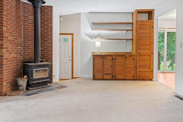 5 Dogford Rd, Hanover, NH 03750 - carpeted living room featuring a wood stove and baseboards